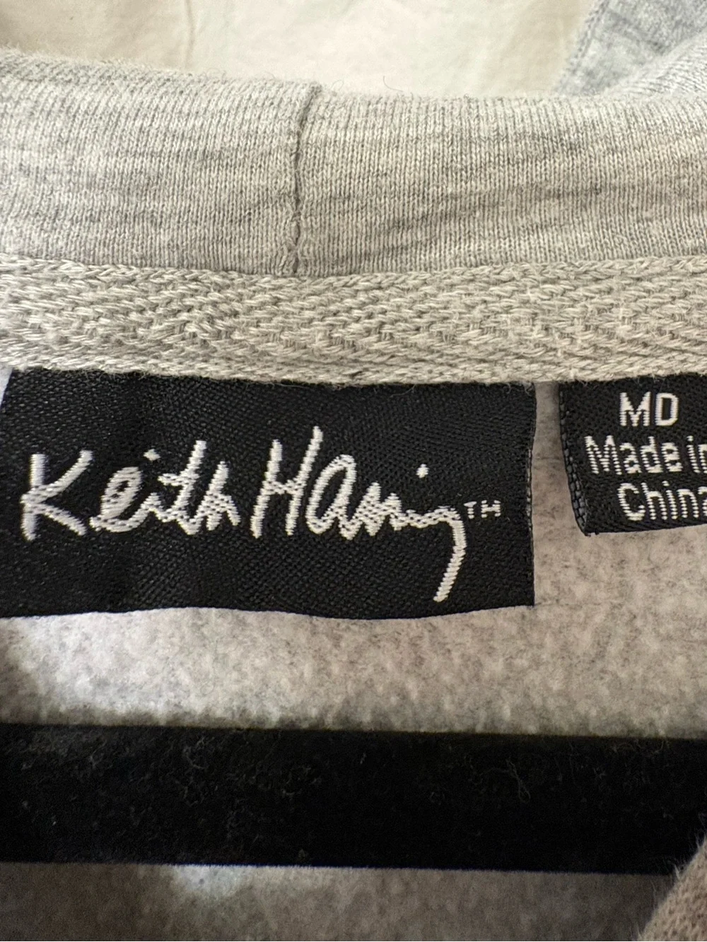 Keith Haring , tie-dye pullover hoodie. Men’s size medium, women’s size large.